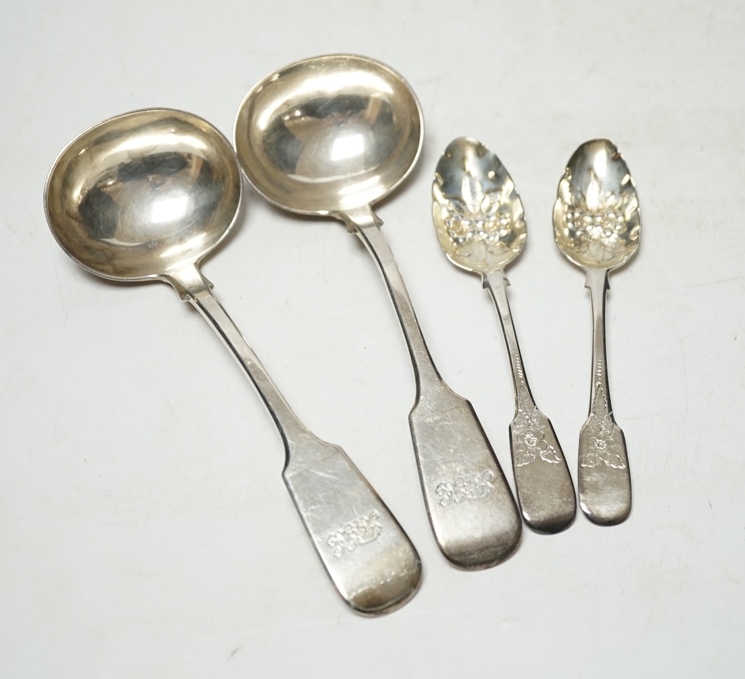 A pair of Victorian provincial silver sauce ladles, by Williams & Son, Exeter, 1852 and two Georgian silver teaspoons. Condition - poor to fair